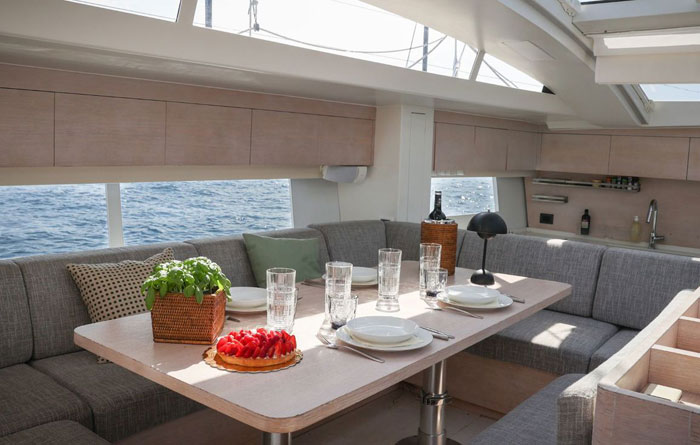 Dining area of sail yacht Luce Guida for rent at Ocean5 yachts