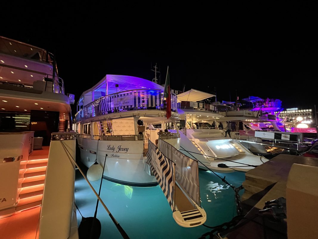 Yacht lit up at night in the Cannes marina