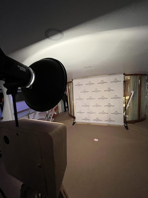 Photo call backdrop with studio light set up on a yacht during TFWA